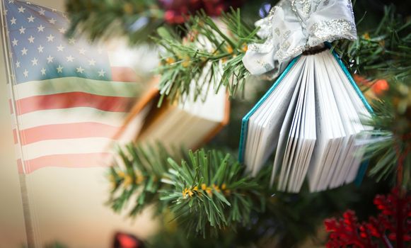 Christamas tree decoration with two small books with usa flag on a background
