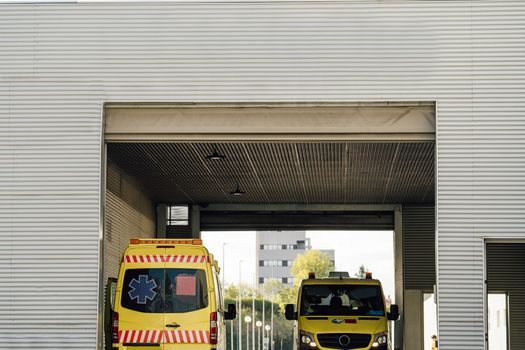 Ambulance car vehicles waiting at Hospital. Patient transportation service with copy space.