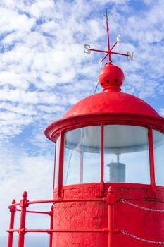 Bright red lighthouse in Nazare close up