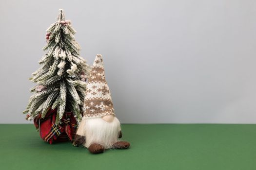 christmas tree and gnome gonk with copy space background. High quality photo