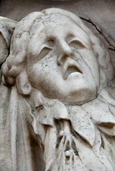 Statue of woman on tomb as a symbol of depression pain and sorrow. High quality photo