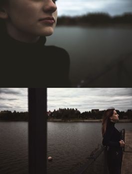 teenage girl young lonelynear the iron fence bulling looks at a gloomy photo into the distance and the renunciate thinks alone with herself and is bored upset on the pier by the water sits on the pier in the evening. High quality photo