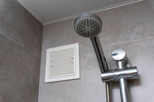 shower stand in the bathroom interior. shower-bath. Shower rack with a round watering can. Bathroom with. Taking a shower comfortably. Minimalistic modern interior