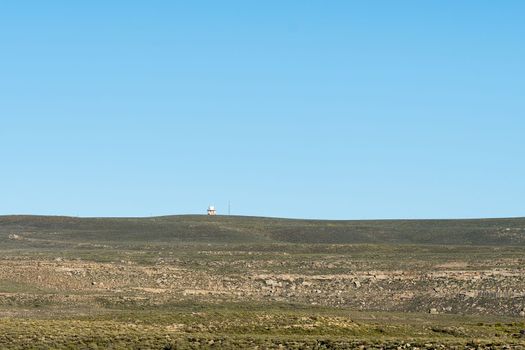 A radar installation is visible on top of Swaarweerberg mountain near Sutherland in the Northern Cape Karoo