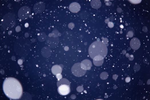 Snowflakes are flying. The tank is white on black. Snow background. copispace