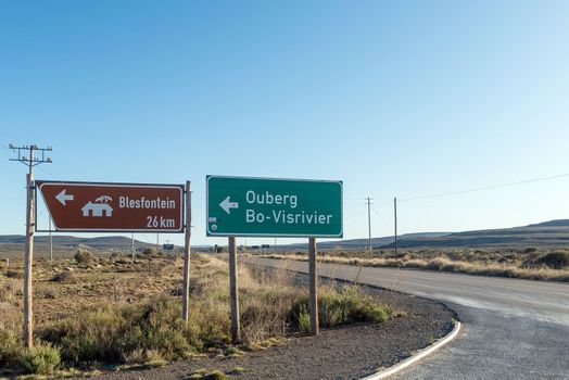 Directional signs at the turn off from road R354 to Ouberg Pass near Sutherland in the Northern Cape Province