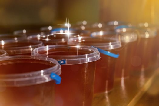 a jar of sweet honey in barrels are stored on a shelf in the pantry sweet food and delicious. High quality photo