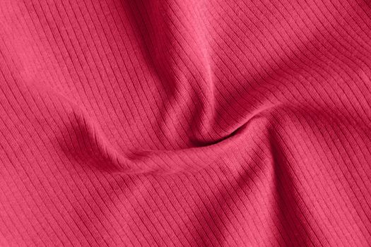 Viva magenta color of the year 2023, ribbed texture of cloth. Fabric pattern