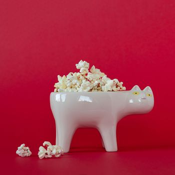 National popcorn day concept. Bowl full of popcorn. Leisure idea.