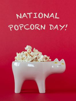 National popcorn day concept. Bowl full of popcorn. Leisure idea.