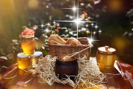 a jar of sweet honey with cheese and roses and fresh bread with bright light beautiful decoration creative photo in a bucket on a wooden table in the garden with flowers for breakfast delicious food. High quality photo