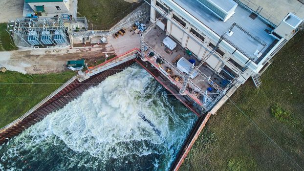 Image of Drone looking down at dam releasing water for river