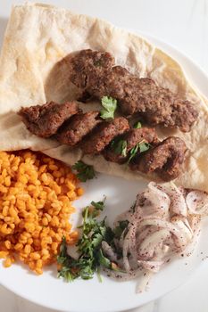 Turkish Adana Kebab with Vegetables on the Plate