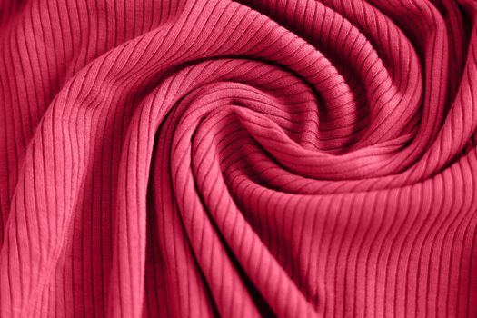 Viva magenta color of the year 2023, ribbed texture of cloth. Fabric pattern