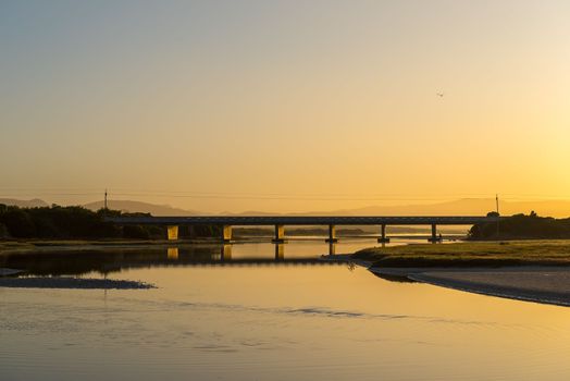Dawn view of the lagoon at Uilenkraalsmond at Franskraalstrand near Gansbaai in the Western Cape Province. The bridge on road R43 over the river is visible