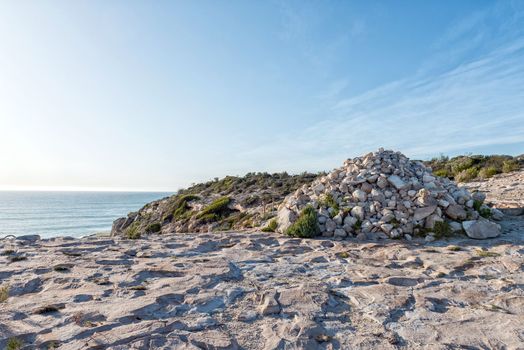 Cairn of rocks on the tral to the Waenhuiskrans Cave near Arniston in the Western Cape Province. The cave is accessable only during low tide