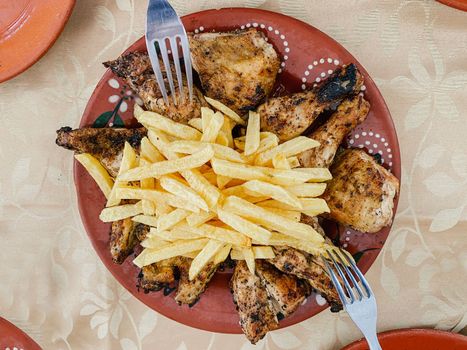 French fries potatoes, grilled tasty chicken. Healthy food and family together concept.