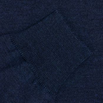Blue wool sweater sleeve close up background