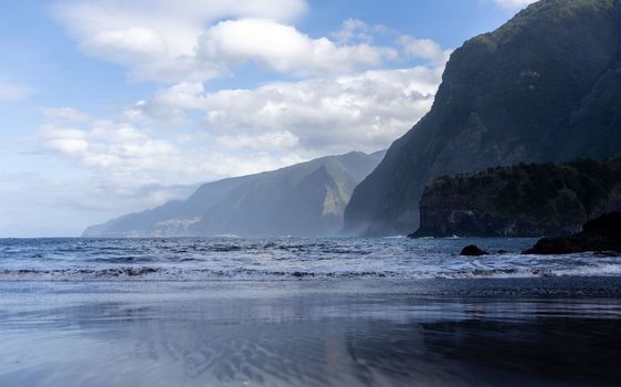 black sand beach of Madeira view on mountains. High quality photo