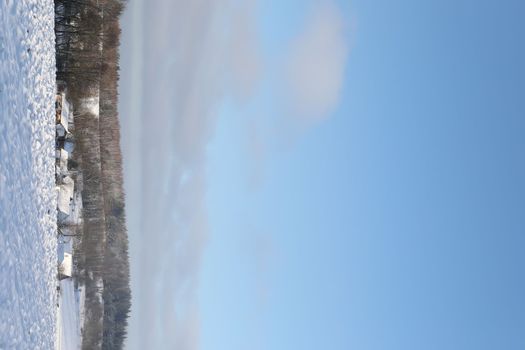 Rural beautiful winter landscape. Non-urban scene. New Year, Christmas. Copy space. Picturesque view of countryside on a frosty winter day
