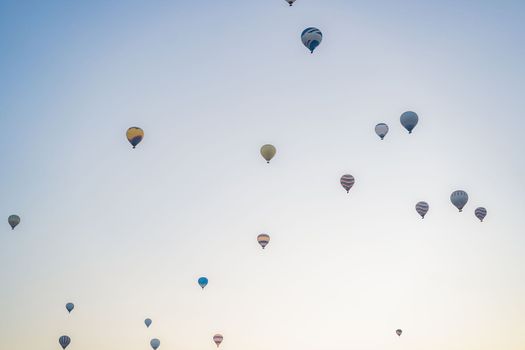 Beautiful hot air balloons over blue sky.