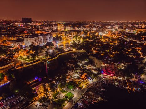 Night top aerial view of the old town Kaleici and old harbor in Antalya, Turkey. Turkey is a popular tourist destination.