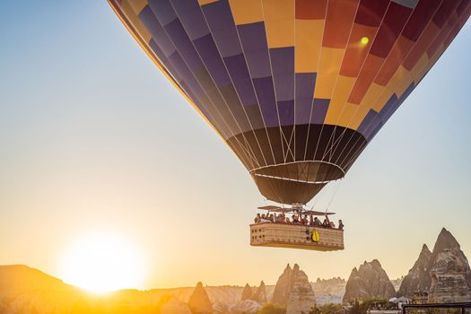 Colorful hot air balloon flying over Cappadocia, Turkey.