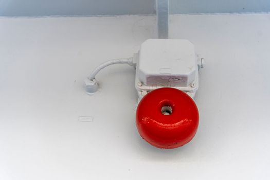 an alarm call on a sea vessel. alarm system installed on the ship, serves to provide a danger sign. alarm systems, Classic vintage alarm bell on the wall of ship. Old red fire bell on the wall