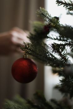 Christmas composition. New Year background. Christmas decoration hanging on tree.