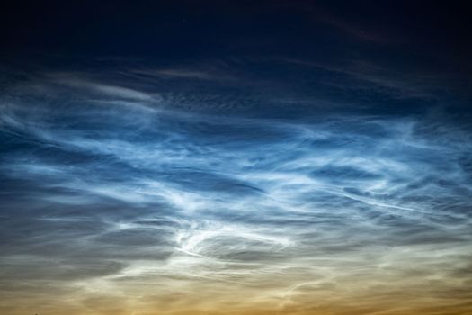 A timelapse of silvery clouds at night