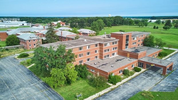 Image of Indiana abandoned Byron Health hospital aerial of brick complex