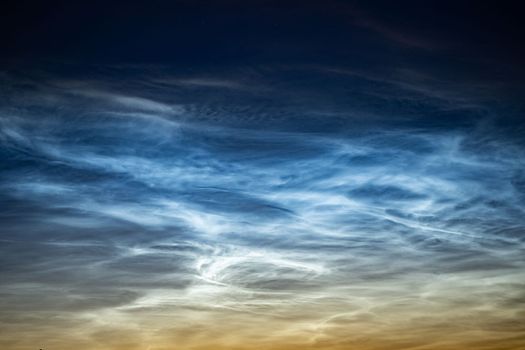 Silver clouds in the night sky in Russia