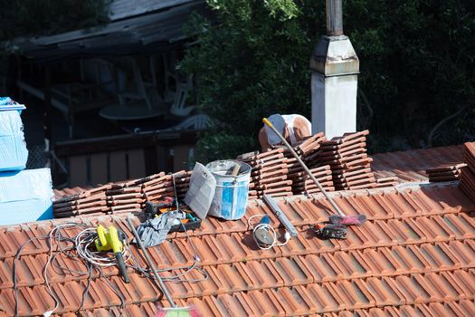 repairing the roof of a home