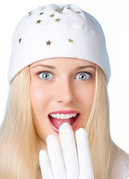 Woman in white hat and gloves, Christmas greetings, and best wishes for the holiday season. Surprised and humorous blonde girl throughout the Christmas, New Year and winter holidays.