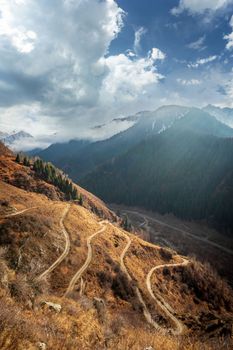 Road serpentines in popular hiking trail The Old Japanese Trail in the Great Almaty Gorge, Kazakhstan nature landscape.