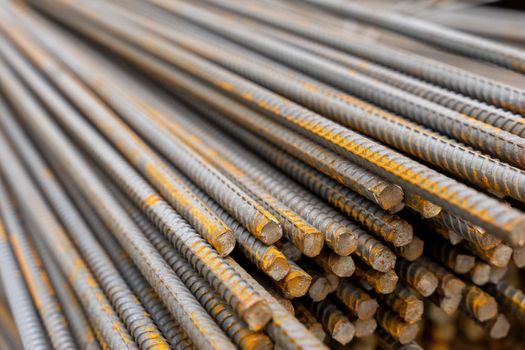 A large bundle of iron construction fittings in close-up. A bunch of new construction iron fittings on the construction site. High quality photo
