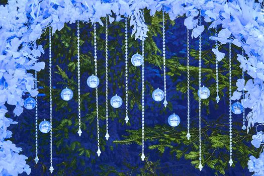 the annual Christian festival celebrating Christ's birth, held on December 25 in the Western Church.New Year's Christmas background with letter balls, garlands and Christmas tree branches