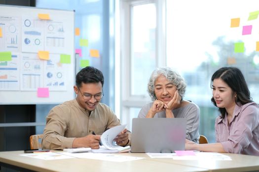 Business team analyzing income charts and graphs ,Financial Analysis with modern laptop computer. Close up.Business analysis and strategy concept..