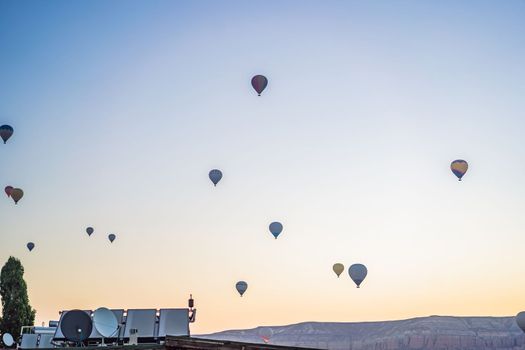 Colorful hot air balloon flying over Cappadocia, Turkey.