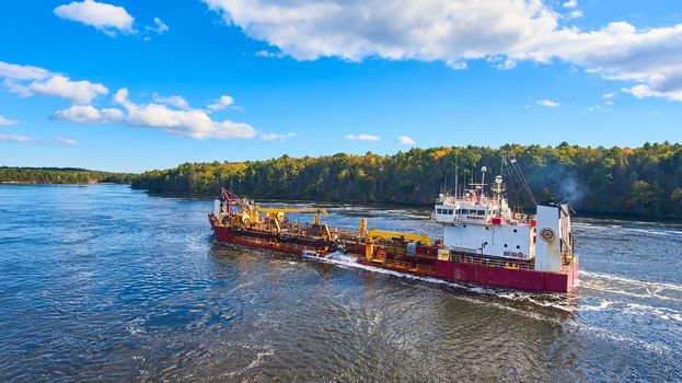 Image of Commercial ship from above sailing through river in Maine