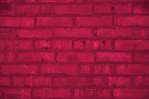 Viva Magenta toned colour grunge decorative brick wall background. Art rough stylized texture banner trendy color 2023.