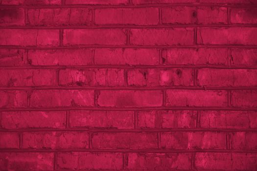 Viva Magenta toned colour grunge decorative brick wall background. Art rough stylized texture banner trendy color 2023.