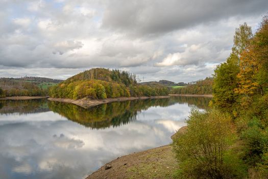 Panoramic image of Agger lake close to Gummersbach in evening light during autumn, Bergisches Land, Germany