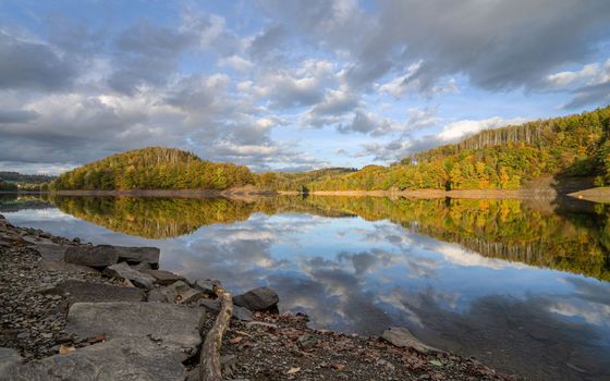 Panoramic image of Agger lake close to Gummersbach in evening light during autumn, Bergisches Land, Germany