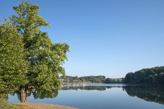 Panoramic image of Bever lake close to Huckeswagen on an early morning during autumn, Bergisches Land, Germany