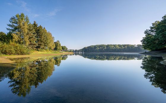 Panoramic image of Bever lake close to Huckeswagen on an early morning during autumn, Bergisches Land, Germany