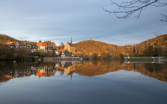 Panoramic image of Beyenburg lake with water reflection and autumnal colors, Wuppertal, Bergisches Land, Germany