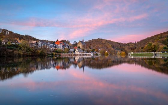 Panoramic image of Beyenburg lake with water reflection and autumnal colors, Wuppertal, Bergisches Land, Germany