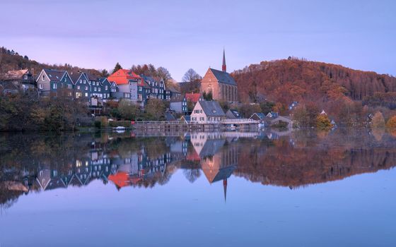 Panoramic image of Beyenburg lake with water reflection and autumnal colors, Wuppertal, Bergisches Land, Germany