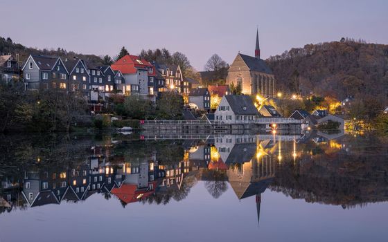 Panoramic image of Beyenburg lake with water reflection and autumnal colors, Wuppertal, Bergisches Land, Germany